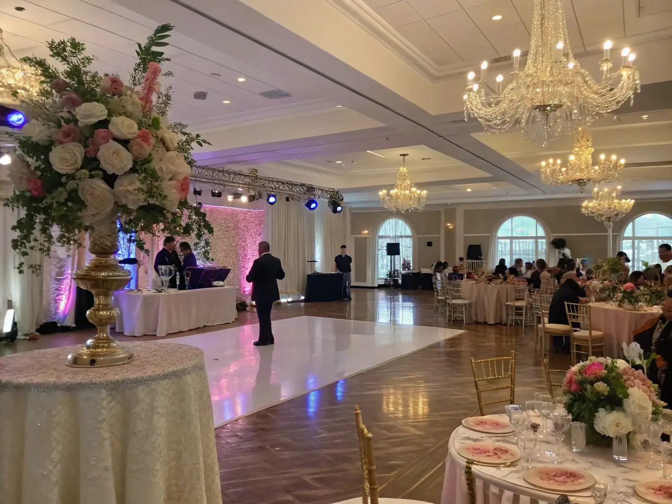 A beautifully decorated wedding venue with elegant lighting and a live band setup, highlighting SoundVision's ability to create magical wedding experiences.